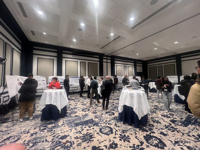 Attendees at a poster session